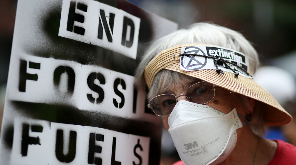 Climate protesters throng New York, demand end to fossil fuels