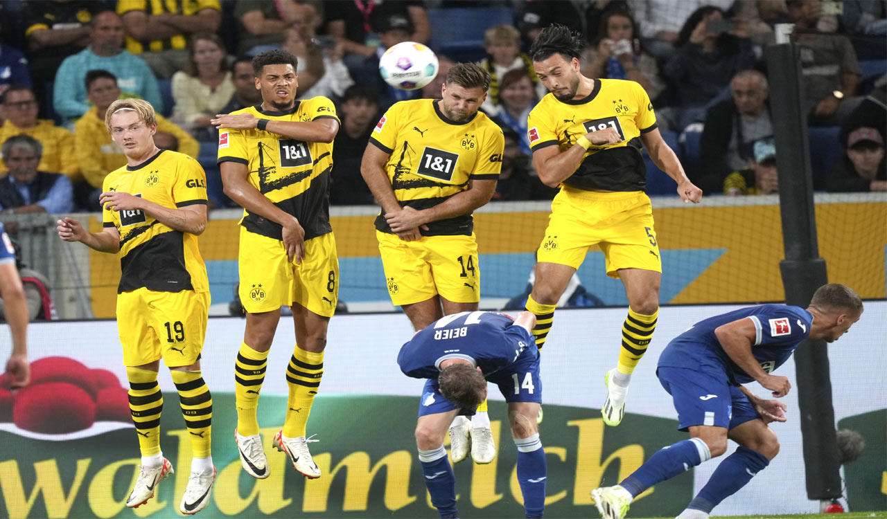 Uneven Dortmund holds on with 10 men to beat Hoffenheim 3-1 in Bundesliga