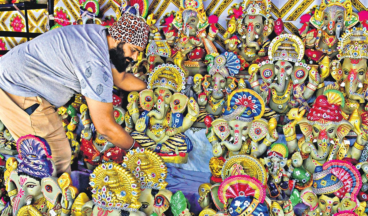 Clay Ganesh idols with seeds ready for distribution in Suryapet