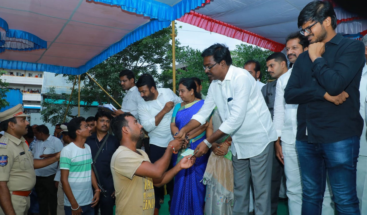 Puvvada distributes cheques to flood affected families in Khammam