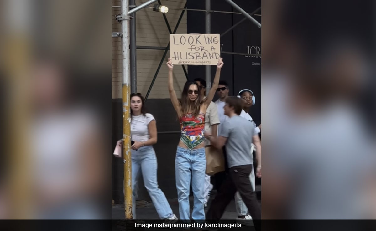 Woman Walks Around New York Streets With "Looking For A Husband" Sign