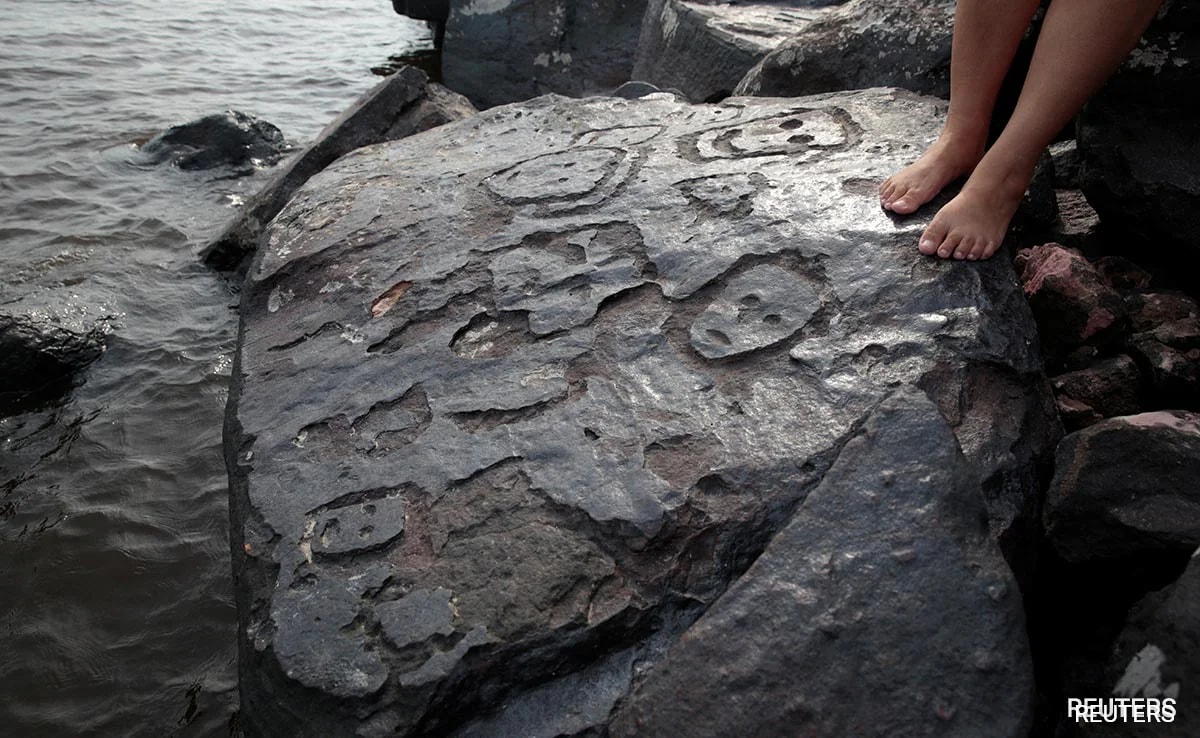 Amazon River Drought Reveals 2,000-Year-Old Human Faces Sculpted In Stone