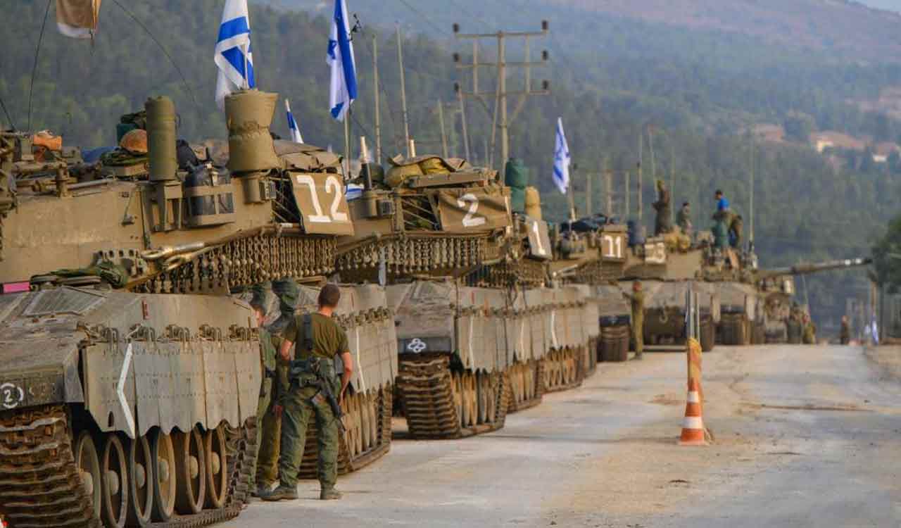 Israeli troops gather near Gaza as Netanyahu issues caution to Hezbollah