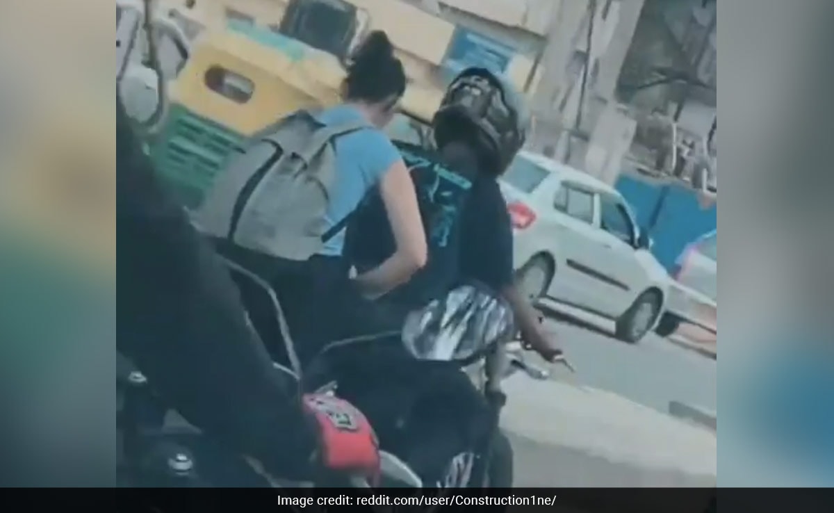 "Typical Day In Bengaluru": Video Of Woman Working On Laptop While Riding Pillion Goes Viral