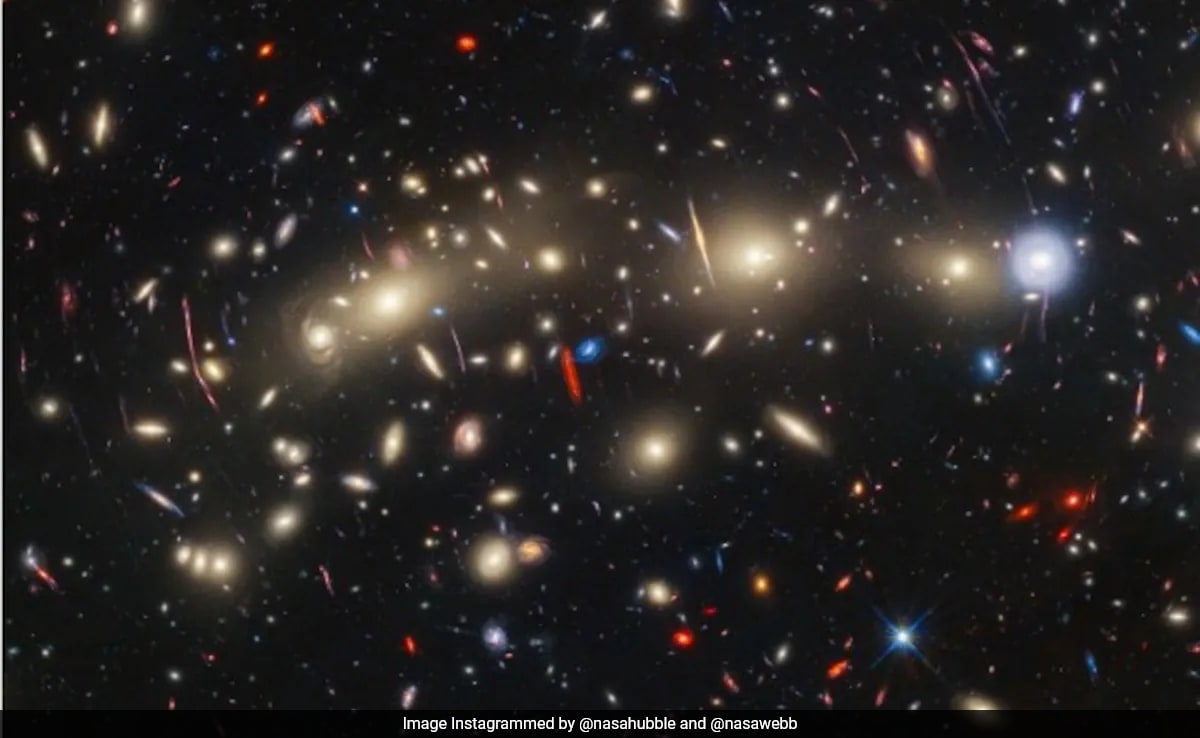 NASA's Webb And Hubble Team Up For Stunning View Of "Christmas Tree Galaxy Cluster"