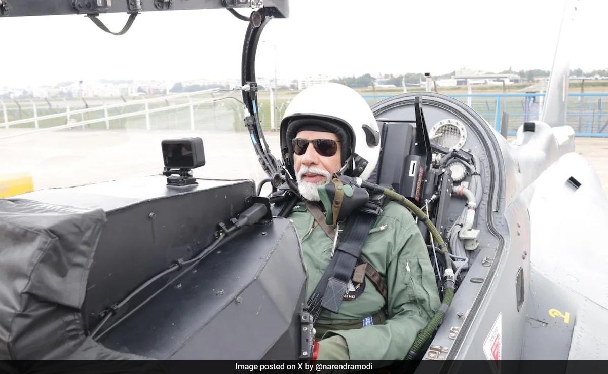 Pics: PM Modi Flies In Light Combat Tejas Fighter Jet In Bengaluru