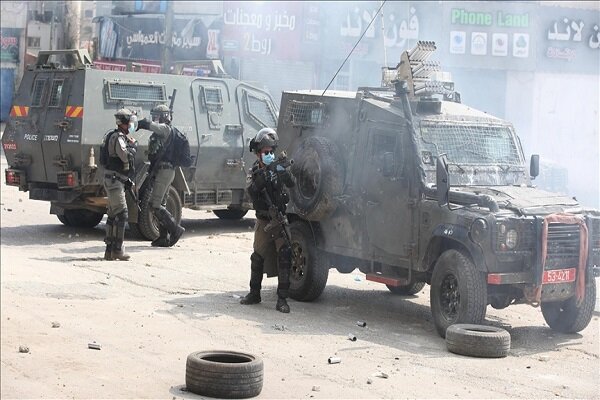 Israeli regime forces raid several areas across West Bank