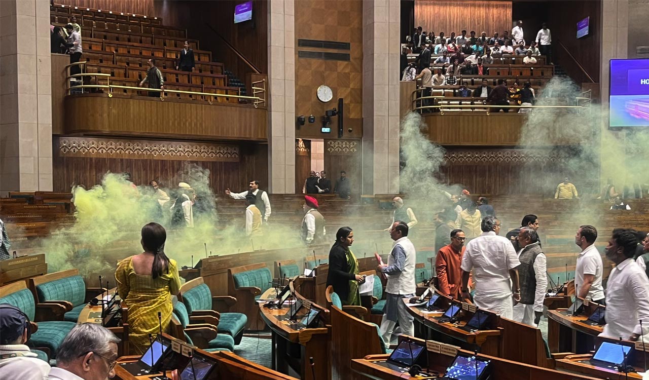 Two persons jump into Lok Sabha from public gallery, proceedings adjourned