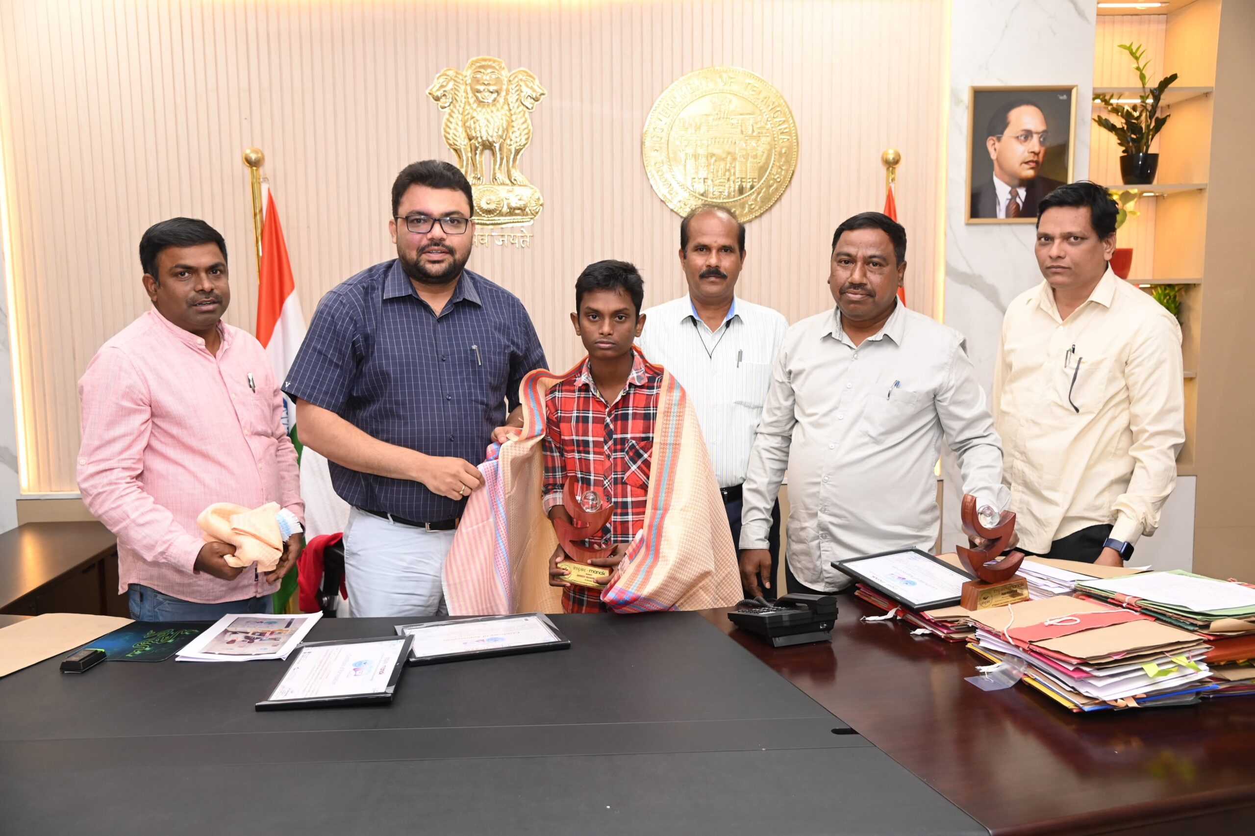 Collector Badavath Santosh felicitates national award winning student in Mancherial