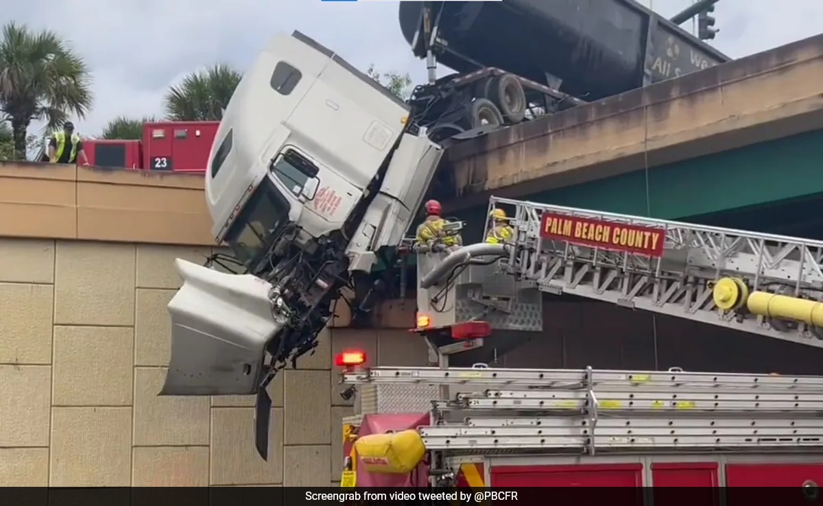 Caught On Camera: US Firefighters Rescue Driver From Dangling Truck