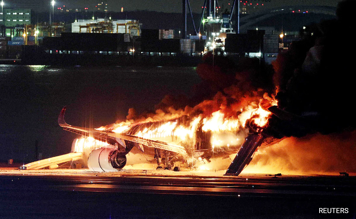 Pics: Plane In Flames At Tokyo Airport After Colliding With Another Aircraft