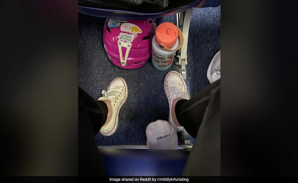 Pic Showing Plane Passenger's Foot Poking Underneath Seat Sparks Debate