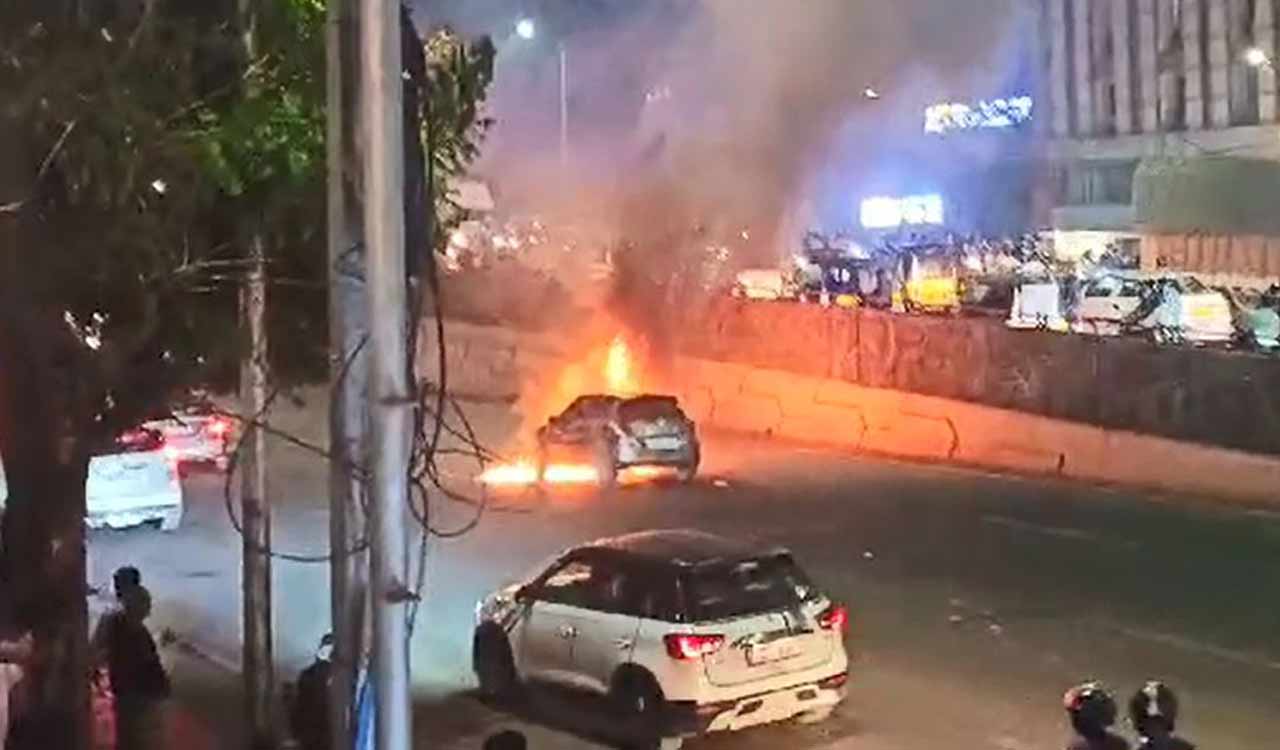 Watch: Car catches fire, traffic flow affected on Telangana Secretariat road