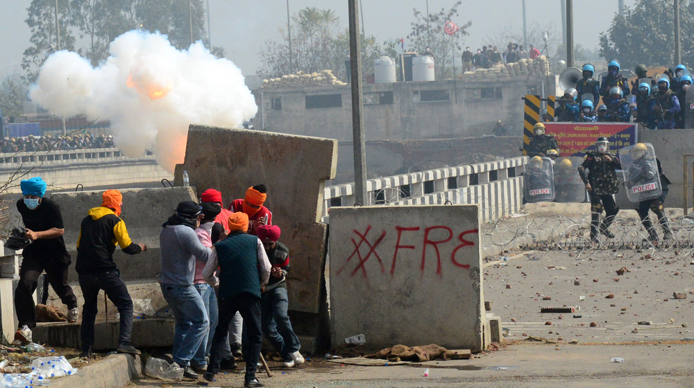 Indian farmers, police exchange tear gas and firecrackers