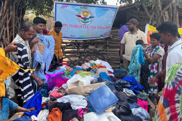 Kothagudem: NGO distributes rice, clothes to adivasis