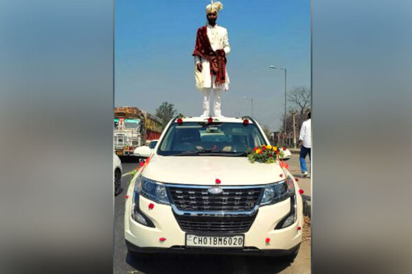 Police seize SUV after viral photo shows groom on top of car