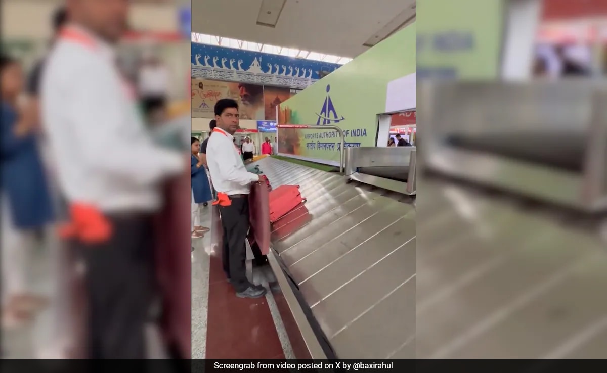 Watch: Airport Staffer Uses Sponge Board To Prevent Luggage Damage