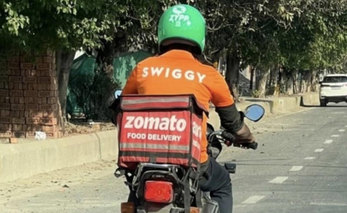 Internet Abuzz Over Food Delivery Agent Carrying Zomato Bag, Wearing Swiggy Shirt And Zypp Helmet