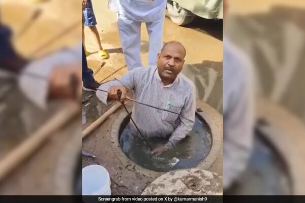 Video: BJP Councillor Cleans Choked Sewer In Gwalior