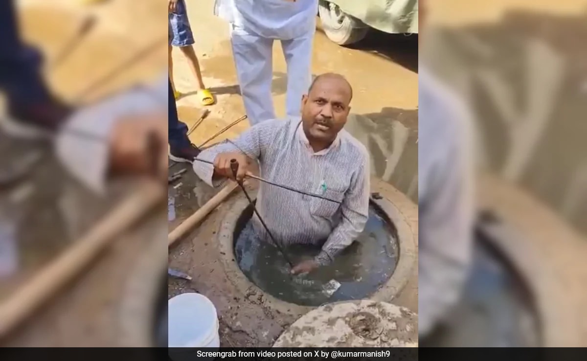 Video: BJP Councillor Cleans Choked Sewer In Gwalior