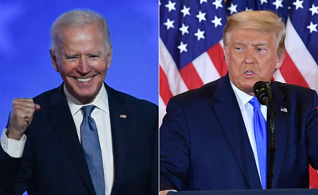 US Voters Prefer Biden's Democracy Approach, Trump's Economy Plan: Report