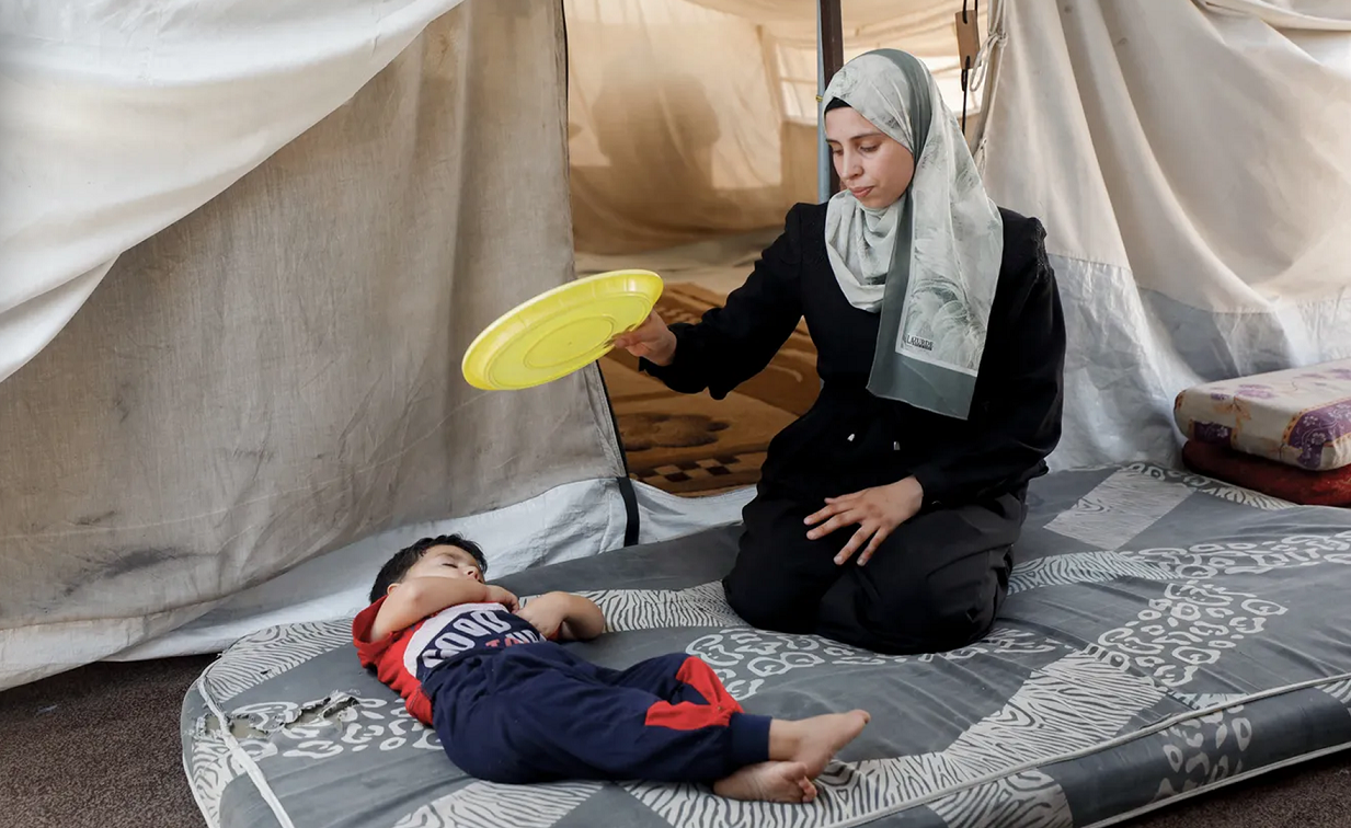 Gaza’s displaced endure scorching heat in tents